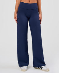 Model wearing Fusion V-Contour High-Rise Petite Pant - Future Navy | Model:Issy | Size:XS | Thumbnail Index: 0