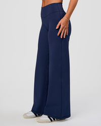 Model wearing Fusion V-Contour High-Rise Petite Pant - Future Navy | Model:Issy | Size:XS | Thumbnail Index: 6