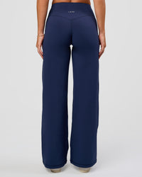 Model wearing Fusion V-Contour High-Rise Petite Pant - Future Navy | Model:Issy | Size:XS | Thumbnail Index: 7