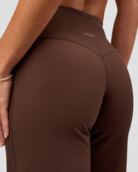 Model wearing Fusion V-Contour High-Rise Petite Pant - Hot Chocolate | Model:Issy | Size:XS | Thumbnail Index: 1