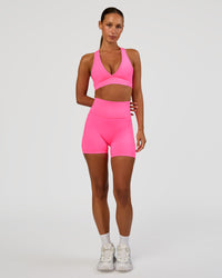 Woman wearing Fusion V-Contour Ultra High-Rise 4” Short Pockets - Sugar Plum | Model:Brylee | Size:XS | Thumbnail Index: 7