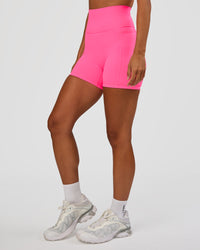 Woman wearing Fusion V-Contour Ultra High-Rise 4” Short Pockets - Sugar Plum | Model:Brylee | Size:XS | Thumbnail Index: 4
