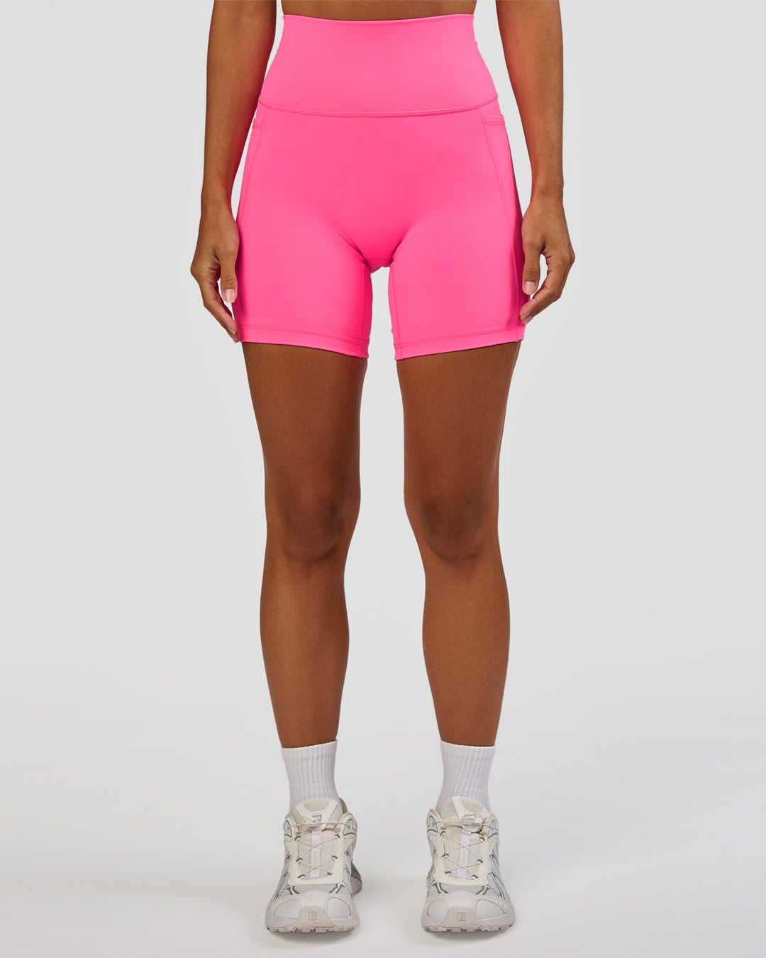 Woman wearing Fusion V-Contour Ultra High-Rise 6" Short Pockets - Sugar Plum | Model:Brylee | Size:XS - view 1