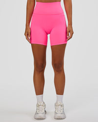 Woman wearing Fusion V-Contour Ultra High-Rise 6" Short Pockets - Sugar Plum | Model:Brylee | Size:XS | Thumbnail Index: 0