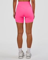 Woman wearing Fusion V-Contour Ultra High-Rise 6" Short Pockets - Sugar Plum | Model:Brylee | Size:XS | Thumbnail Index: 3