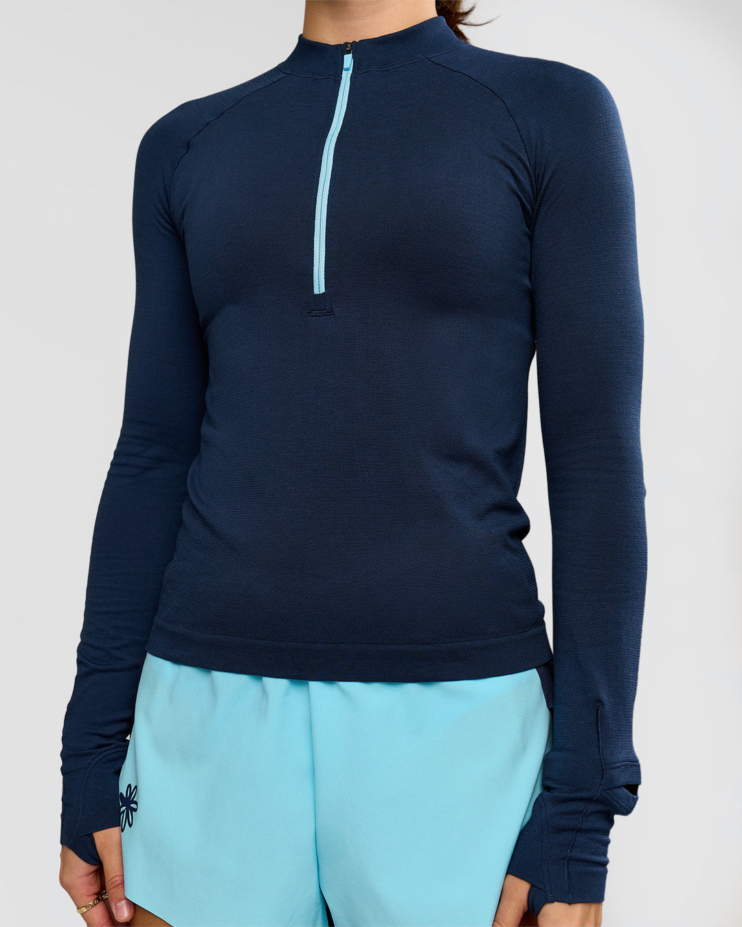 Woman wearing GG AeroFLX+ Long Sleeve Half Zip - Future Navy-Baltic Sea | Model:Grace | Size:XS - view 11