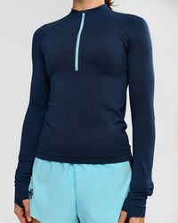 Woman wearing GG AeroFLX+ Long Sleeve Half Zip - Future Navy-Baltic Sea | Model:Grace | Size:XS | Thumbnail Index: 10