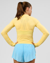 Woman wearing GG AeroFLX+ Long Sleeve Half Zip - Lemon-Baltic Sea | Model:Grace | Size:XS | Thumbnail Index: 3
