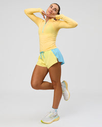 Woman wearing GG AeroFLX+ Long Sleeve Half Zip - Lemon-Baltic Sea | Model:Grace | Size:XS | Thumbnail Index: 5