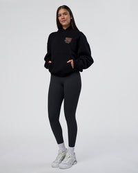 Woman wearing GTC CVC Fleece Unisex Oversized Hoodie - Black-Cantaloupe | Model:Rhiley | Size:XS | Thumbnail Index: 8