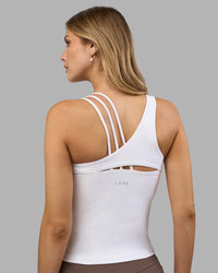 Woman wearing Galvanise Splice Shelf Bra Tank - White | Model:Leilani | Size:XS | Thumbnail Index: 1