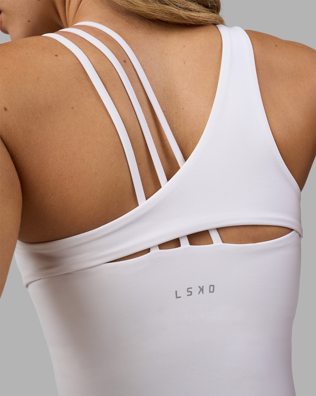Woman wearing Galvanise Splice Shelf Bra Tank - White | Model:Leilani | Size:XS - view 3