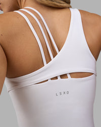 Woman wearing Galvanise Splice Shelf Bra Tank - White | Model:Leilani | Size:XS | Thumbnail Index: 2