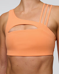 Woman wearing Galvanise Splice Sports Bra - Cantaloupe | Model:Emelia | Size:XS | Thumbnail Index: 5