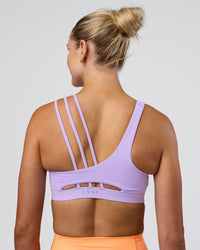 Woman wearing Galvanise Splice Sports Bra - Pale Lilac | Model:Emelia | Size:XS | Thumbnail Index: 4
