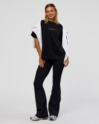 Woman wearing Go-To 1% Better Every Day FLXCotton Oversized Tee - Black-White | Model:Amity | Size:XS | Thumbnail Index: 1