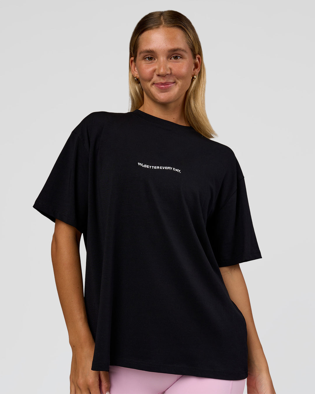 Woman wearing Go-To 1% Better Every Day FLXCotton Oversized Tee - Black-White | Model:Amity | Size:XS - view 1