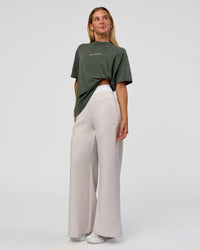 Woman wearing Go-To 1% Better Every Day FLXCotton Oversized Tee - Carbon Green Washed-White | Model:Amity | Size:XS | Thumbnail Index: 4