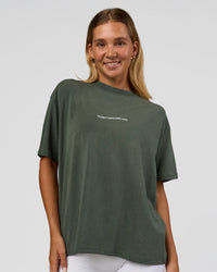 Woman wearing Go-To 1% Better Every Day FLXCotton Oversized Tee - Carbon Green Washed-White | Model:Amity | Size:XS | Thumbnail Index: 0