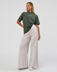 Woman wearing Go-To 1% Better Every Day FLXCotton Oversized Tee - Carbon Green Washed-White | Model:Amity | Size:XS | Thumbnail Index: 6