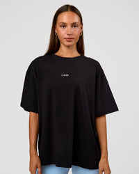 Woman wearing Go-To Break Through FLXCotton Oversized Tee - Black-Open Air | Model:Brylee | Size:XS | Thumbnail Index: 2