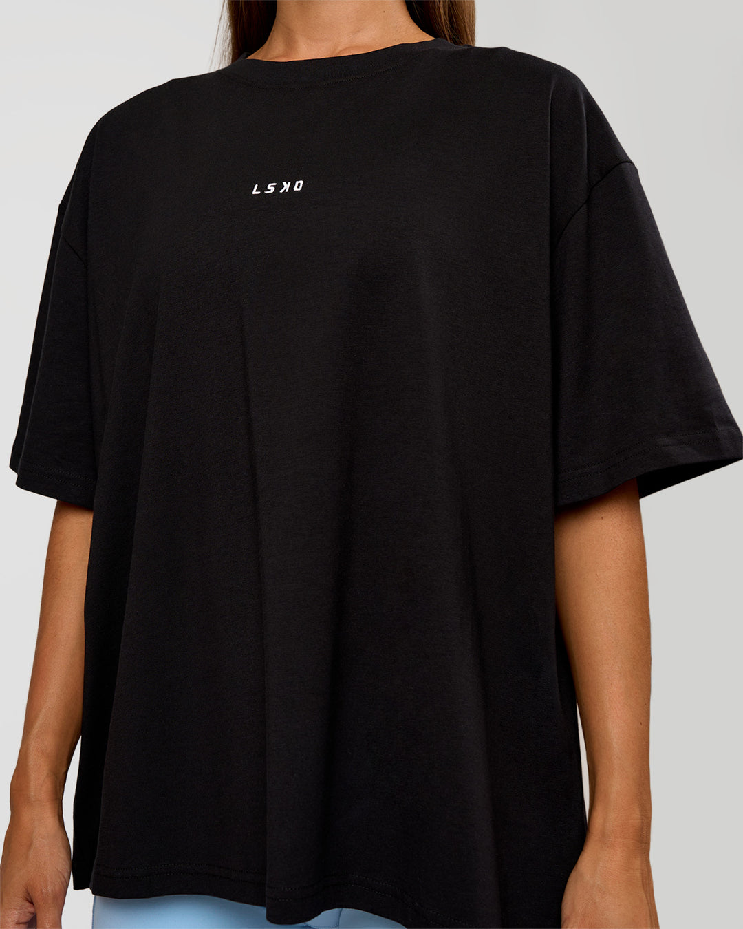 Woman wearing Go-To Break Through FLXCotton Oversized Tee - Black-Open Air | Model:Brylee | Size:XS - view 5