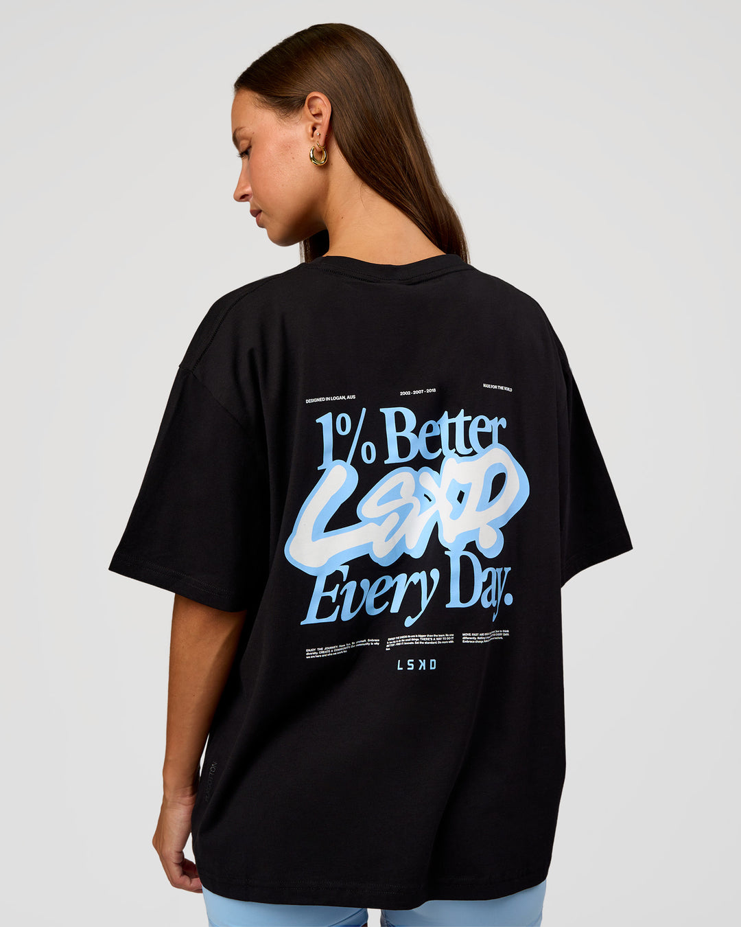 Woman wearing Go-To Break Through FLXCotton Oversized Tee - Black-Open Air | Model:Brylee | Size:XS - view 1