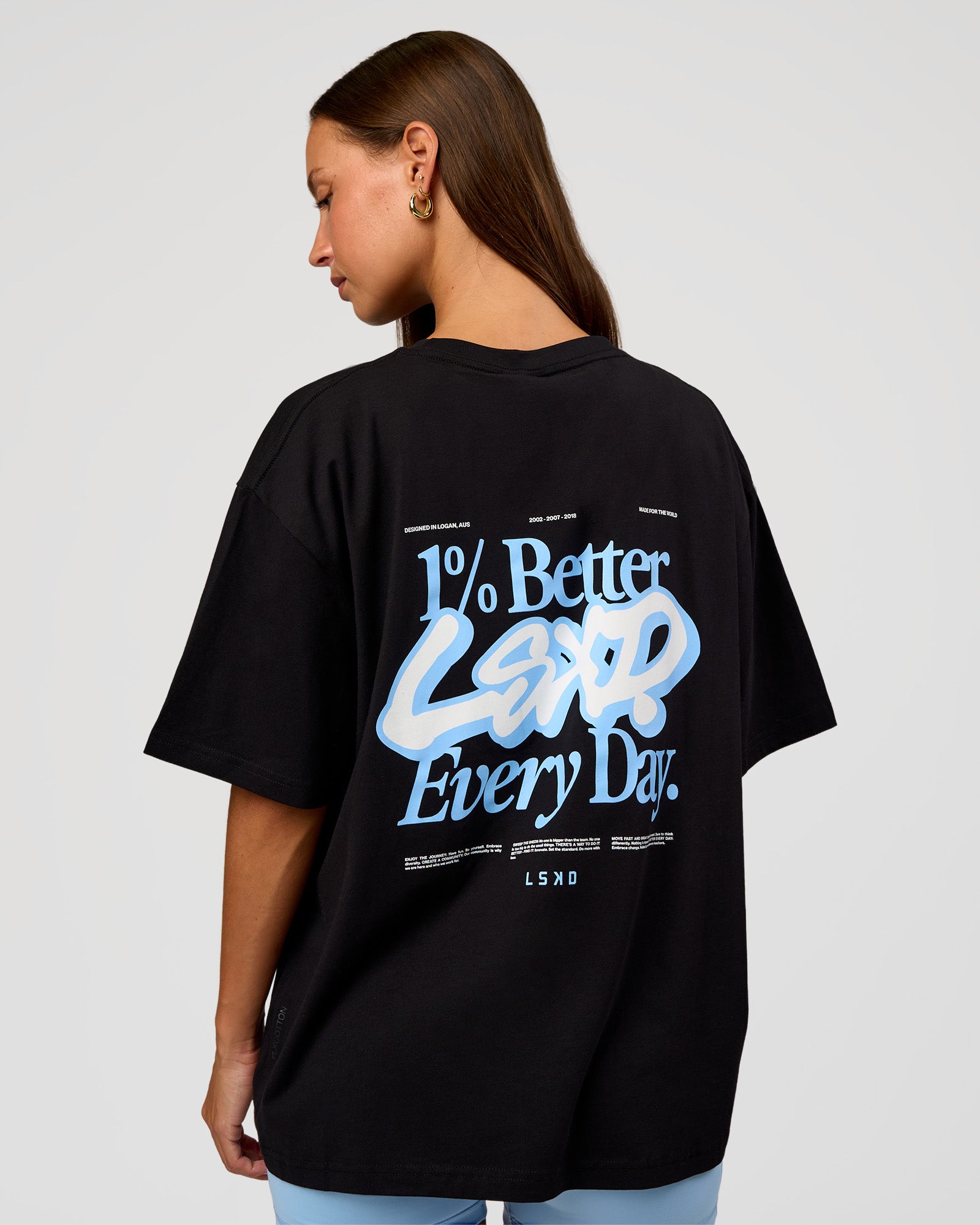 Woman wearing Go-To Break Through FLXCotton Oversized Tee - Black-Open Air | Model:Brylee | Size:XS