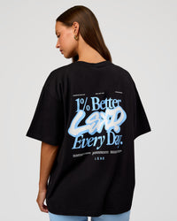 Woman wearing Go-To Break Through FLXCotton Oversized Tee - Black-Open Air | Model:Brylee | Size:XS | Thumbnail Index: 0