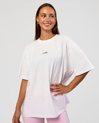 Woman wearing Go-To Break Through FLXCotton Oversized Tee - White-Marshmallow | Model:Brylee | Size:XS | Thumbnail Index: 1