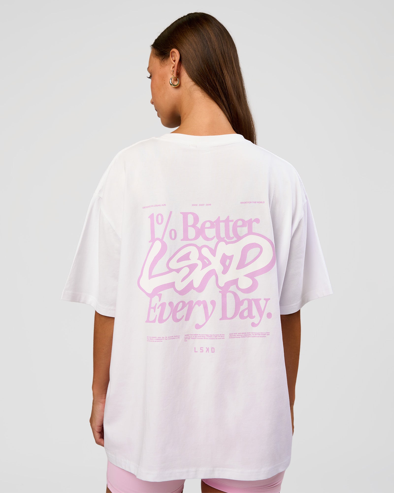 Woman wearing Go-To Break Through FLXCotton Oversized Tee - White-Marshmallow | Model:Brylee | Size:XS