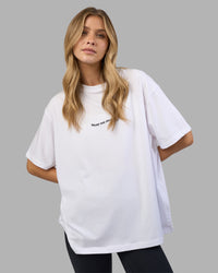 Woman wearing Go-To E.T.J FLXCotton Oversized Tee - White-Black | Model:Leilani | Size:XS | Thumbnail Index: 0