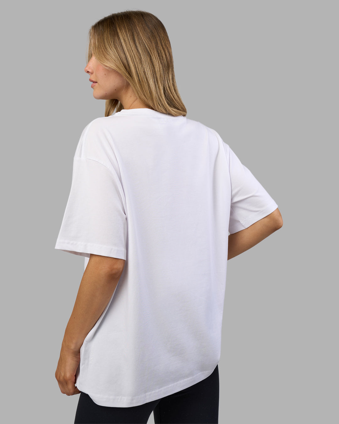 Woman wearing Go-To E.T.J FLXCotton Oversized Tee - White-Black | Model:Leilani | Size:XS - view 4