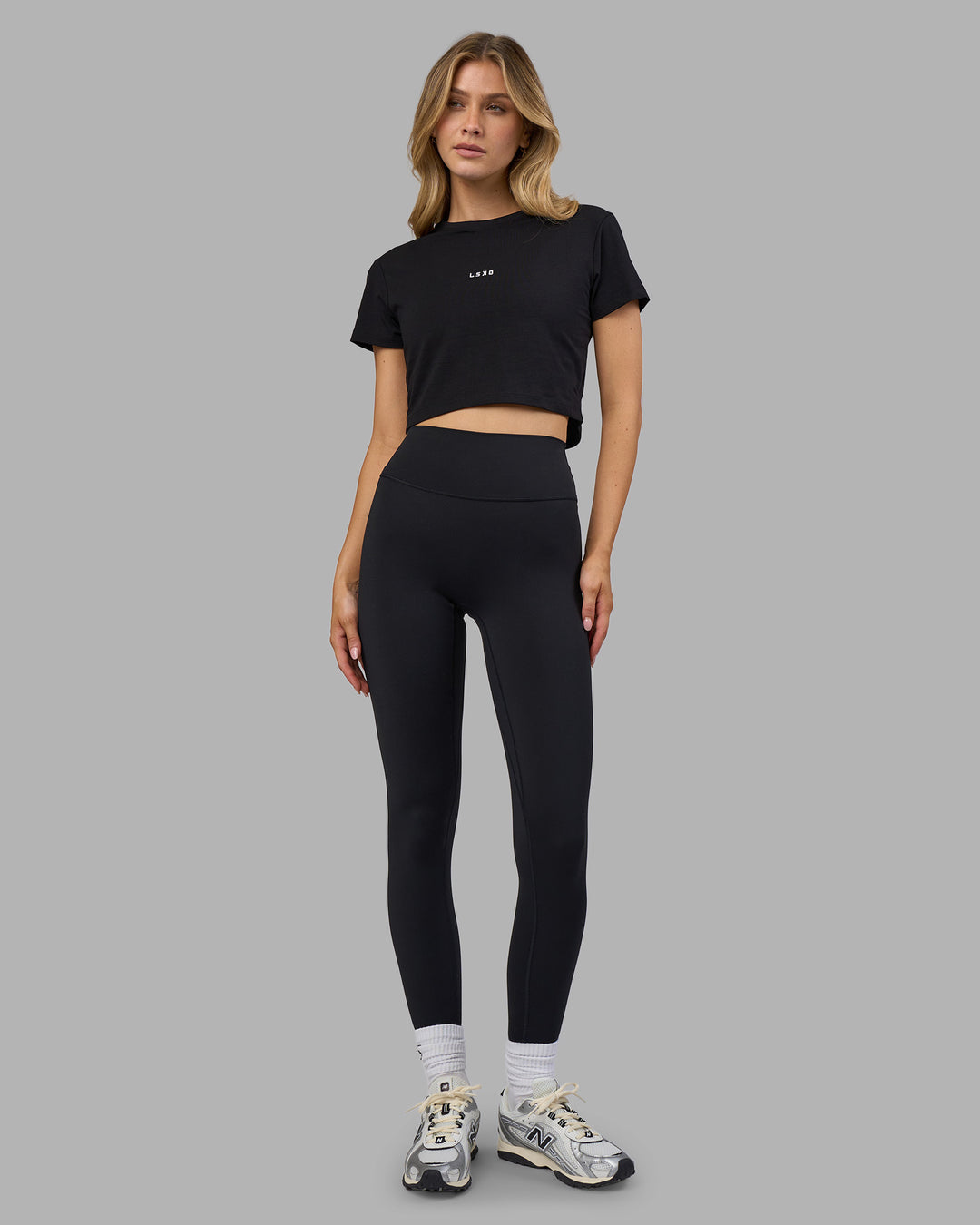 Woman wearing Go-To FLXCotton Baby Tee - Black-White | Model:Leilani | Size:XS - view 4