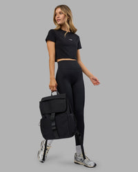 Woman wearing Go-To FLXCotton Baby Tee - Black-White | Model:Leilani | Size:XS | Thumbnail Index: 1