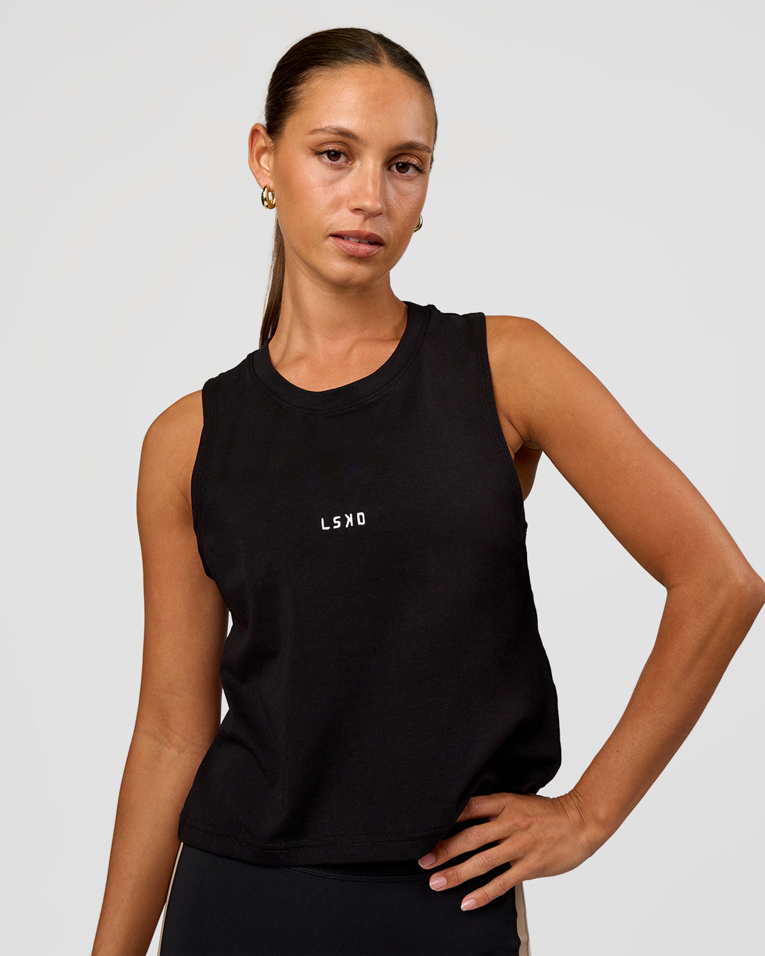 Woman wearing Go-To FLXCotton Midline Tank - Black-White | Model:Brylee | Size:XS - view 1