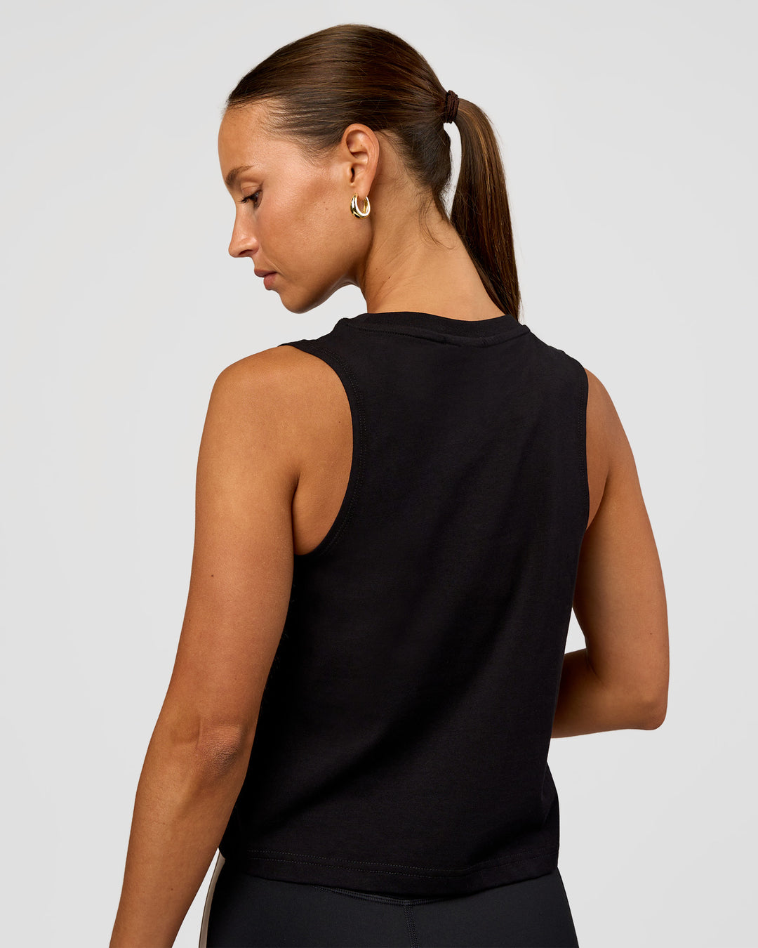 Woman wearing Go-To FLXCotton Midline Tank - Black-White | Model:Brylee | Size:XS - view 2