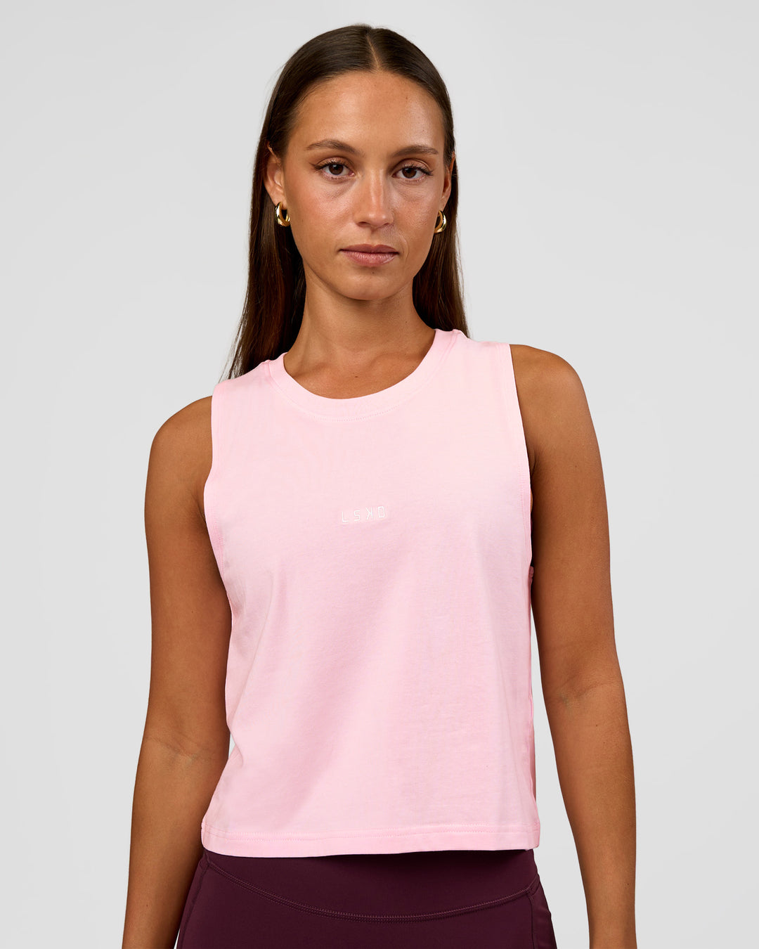 Woman wearing Go-To FLXCotton Midline Tank - Marshmallow-White | Model:Brylee | Size:XS - view 1