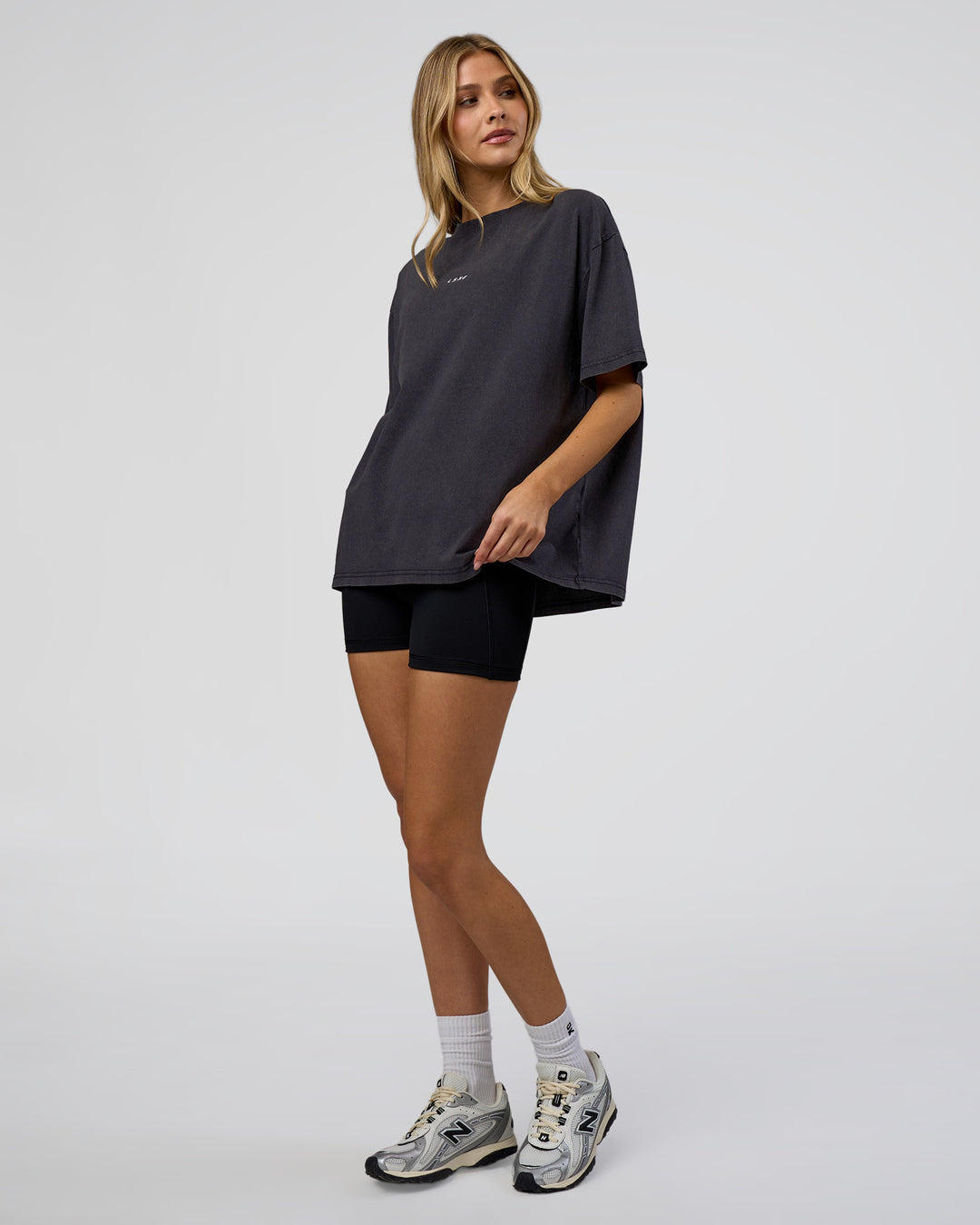 Woman wearing Go-To FLXCotton Oversized Tee - Black Washed-White | Model:Leilani | Size:S - view 2