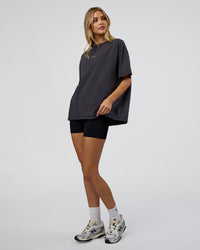 Woman wearing Go-To FLXCotton Oversized Tee - Black Washed-White | Model:Leilani | Size:S | Thumbnail Index: 1