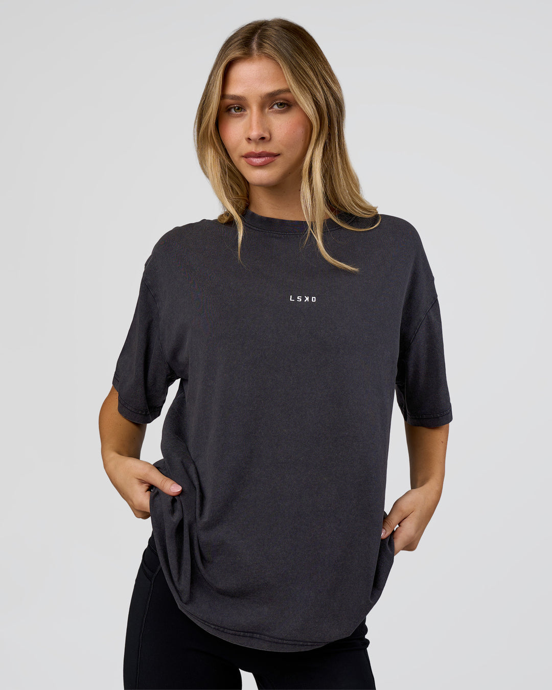 Woman wearing Go-To FLXCotton Oversized Tee - Black Washed-White | Model:Leilani | Size:S - view 1