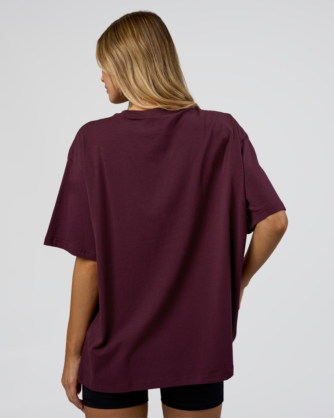 Woman wearing Go-To FLXCotton Oversized Tee - Cherry Lacquer-White | Model:Leilani | Size:XS - view 3