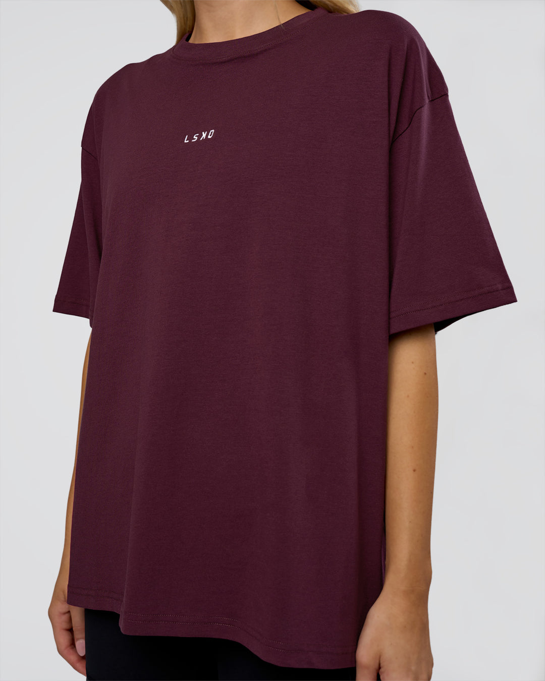 Woman wearing Go-To FLXCotton Oversized Tee - Cherry Lacquer-White | Model:Leilani | Size:XS - view 5