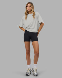 Woman wearing Go-To FLXCotton Oversized Tee - Digital Mist-White | Model:Leilani | Size:XS | Thumbnail Index: 0