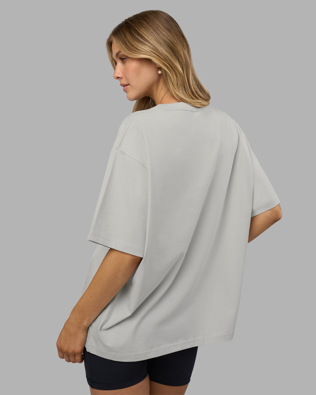 Woman wearing Go-To FLXCotton Oversized Tee - Digital Mist-White | Model:Leilani | Size:XS - view 4