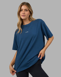 Woman wearing Go-To FLXCotton Oversized Tee - Indigo-White | Model:Leilani | Size:XS | Thumbnail Index: 0