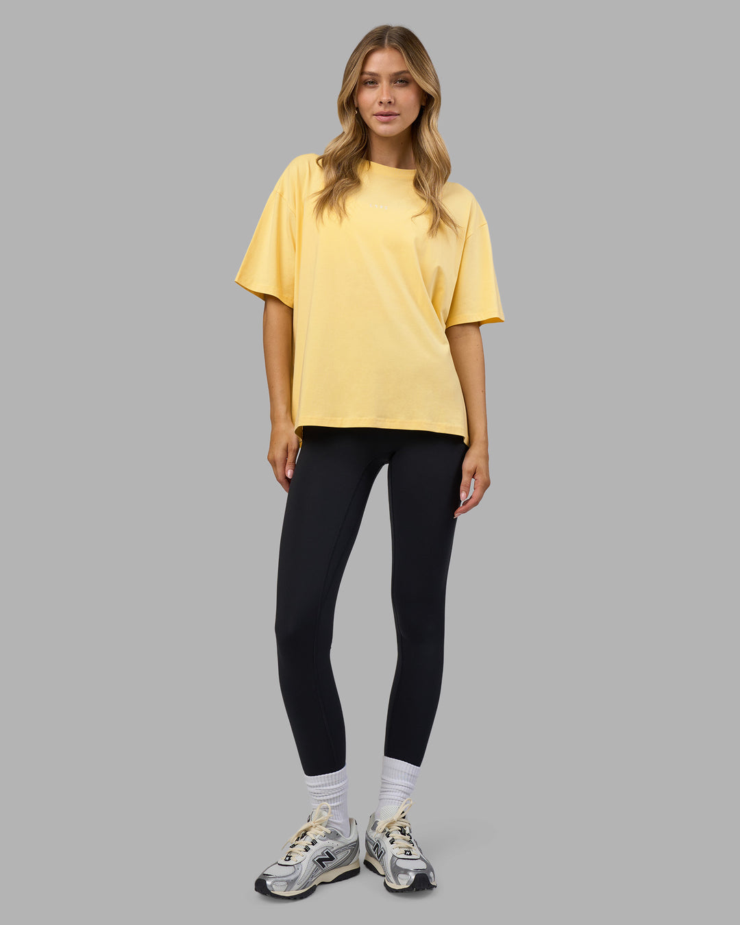 Woman wearing Go-To FLXCotton Oversized Tee - Lemon-White | Model:Leilani | Size:XS - view 2