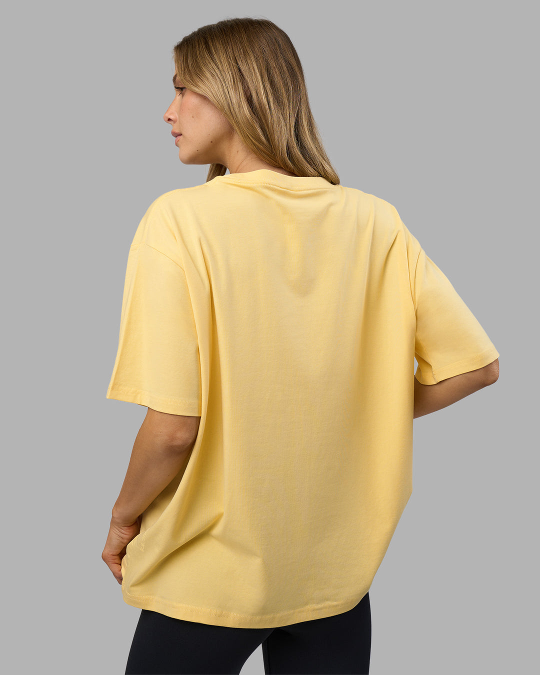 Woman wearing Go-To FLXCotton Oversized Tee - Lemon-White | Model:Leilani | Size:XS - view 3