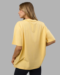 Woman wearing Go-To FLXCotton Oversized Tee - Lemon-White | Model:Leilani | Size:XS | Thumbnail Index: 2