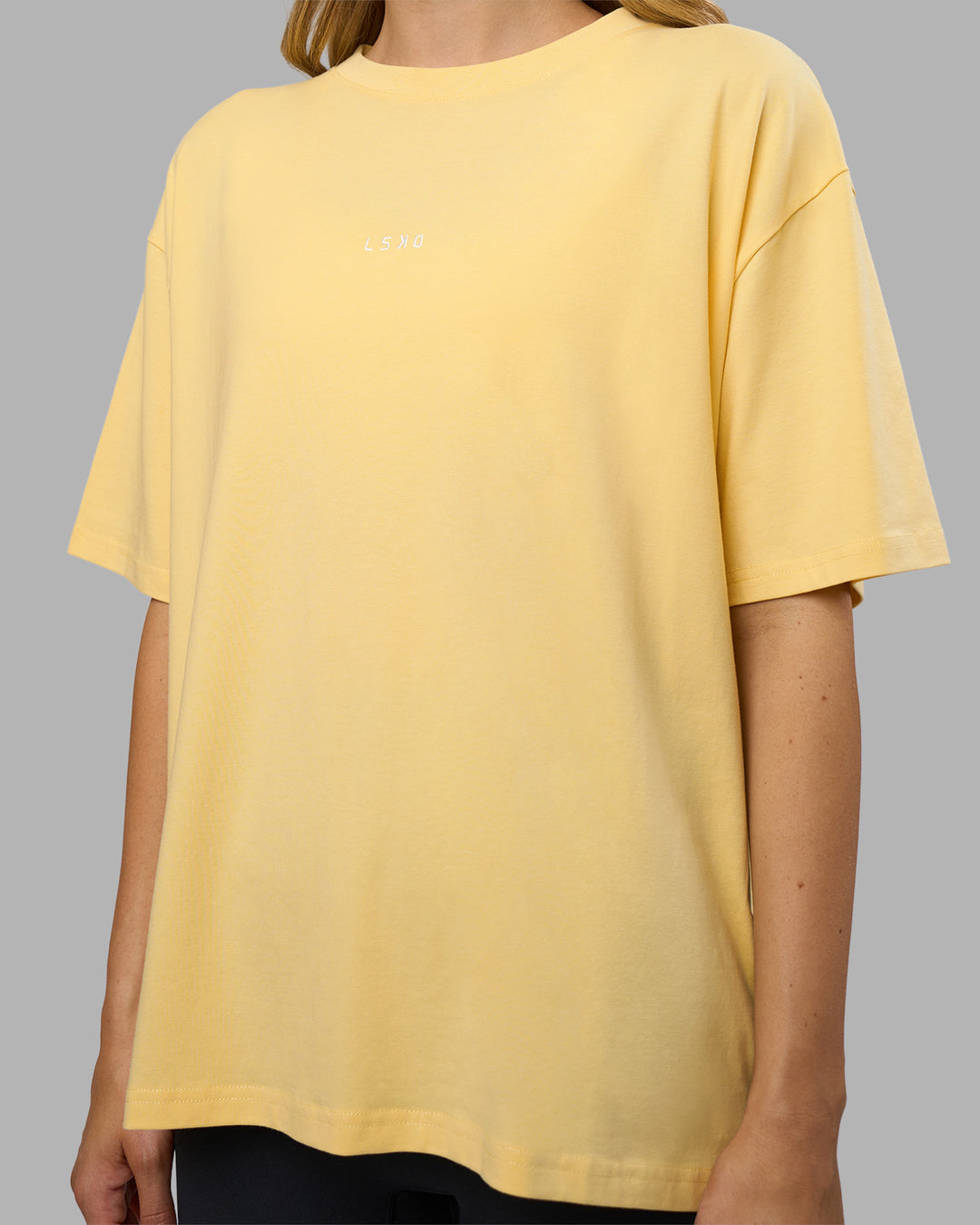 Woman wearing Go-To FLXCotton Oversized Tee - Lemon-White | Model:Leilani | Size:XS - view 4